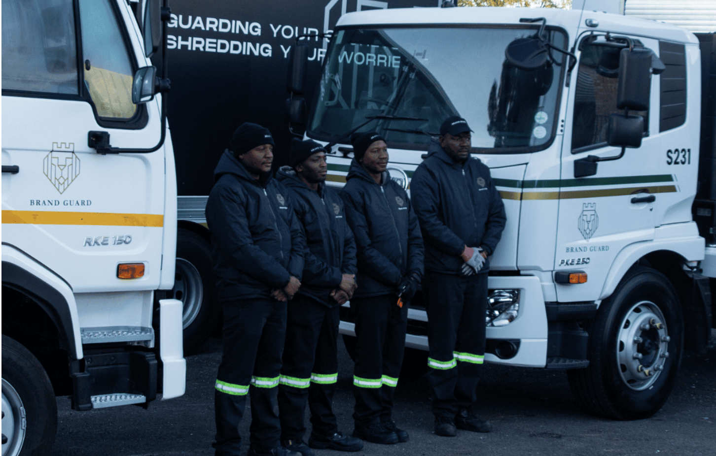 Brand Guard uniformed operators in front of the shred fleet
